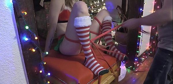  tied up Santa&039;s Helper gets toys used on her